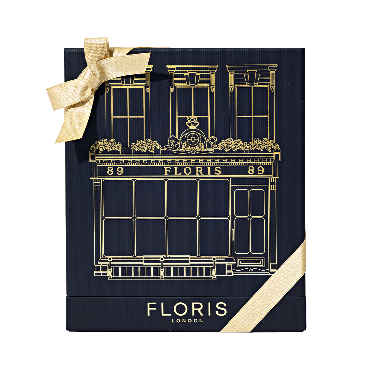 Floris London US "The Icon | No. 89 Duo" gift box in navy with gold building illustration, logo, and finished with a gold ribbon bow.