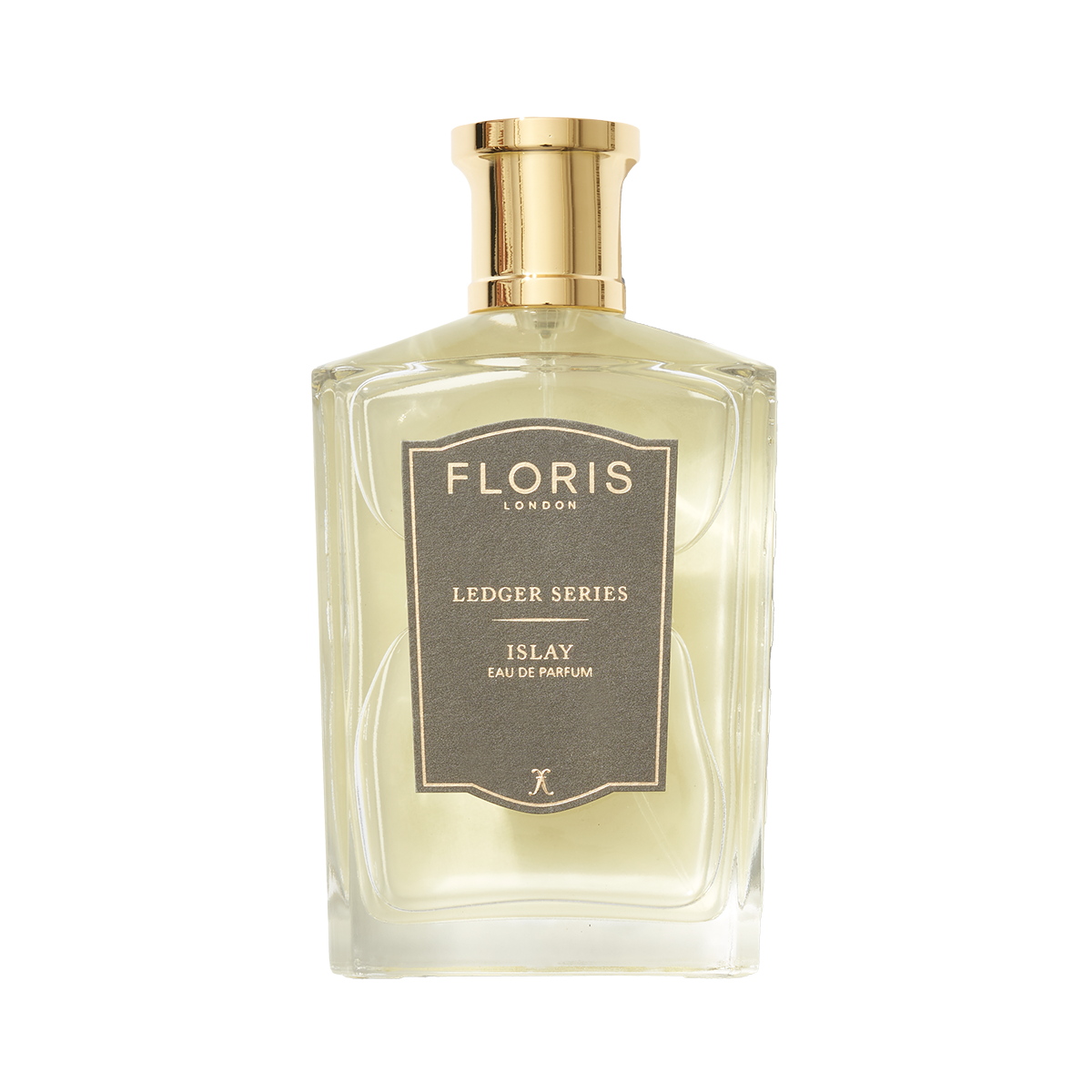 A clear bottle of Floris London Islay Eau de Parfum with a gold cap, gray label, and a peaty smoky scent.