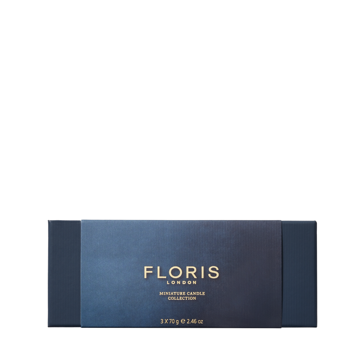 The Floris London Miniature Candle Collection features exquisite miniature scented candles in a dark blue rectangular box with gold text.