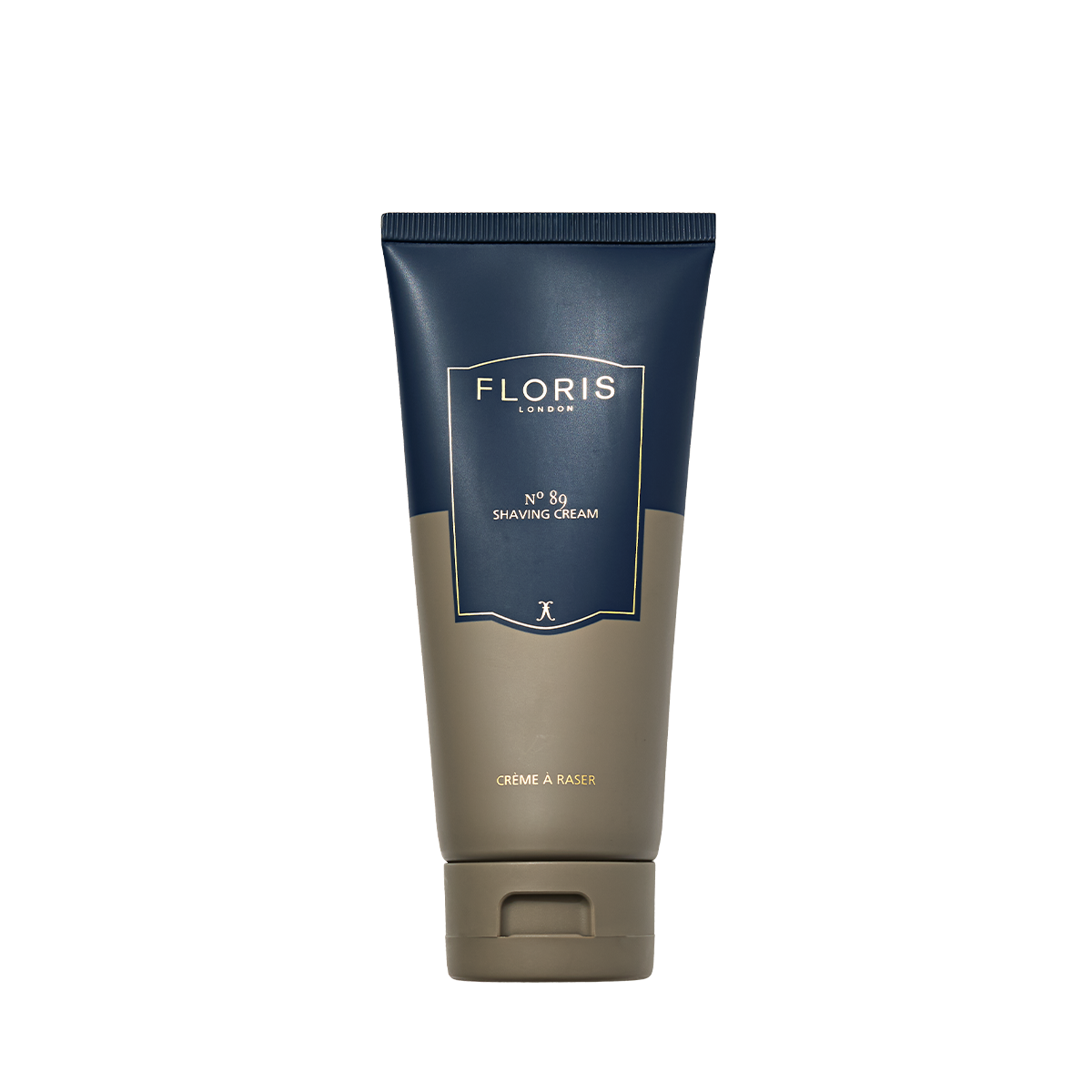A 100ml tube of Floris London No. 89 Shaving Cream stands upright, featuring a blue and beige design.