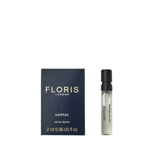 A Floris London Santal - Eau de Toilette sample vial sits next to its navy blue box, both featuring gold and black labels—a refined men’s scent.