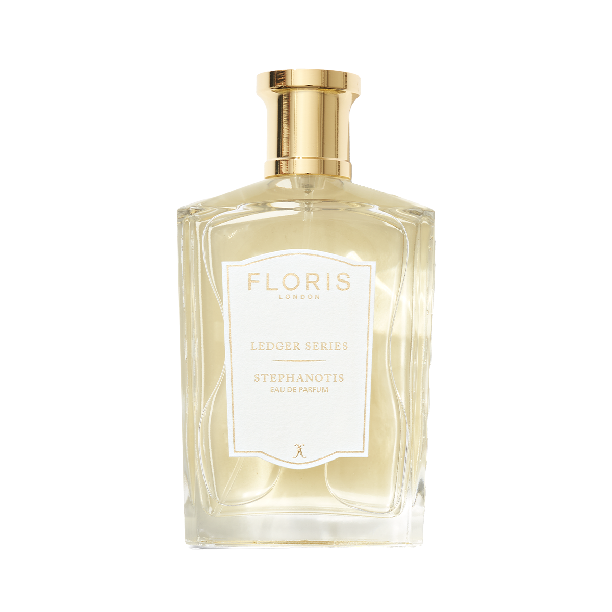 A clear glass bottle of Floris London Stephanotis with a gold cap, white label, and a fresh green floral fragrance of stephanotis blossom.