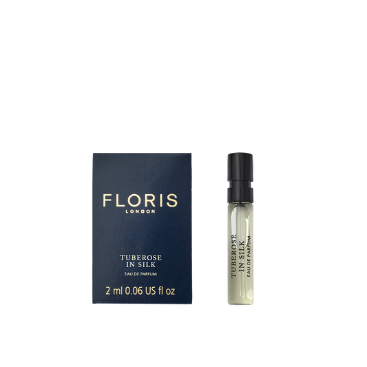 A Floris London Tuberose In Silk - Eau de Parfum sample with navy box and spray vial, featuring notes of tuberose and jasmine.