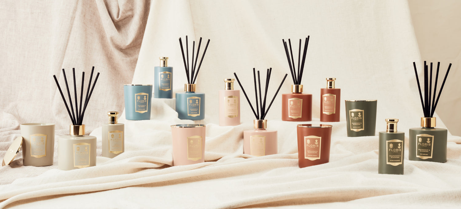 A collection of Floris London US products, including candles, fragrances, and reed diffusers, arranged in an elegant and sophisticated display.