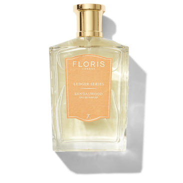 A rectangular glass bottle of Floris London's Sandalwood fragrance, featuring a gold cap and label.
