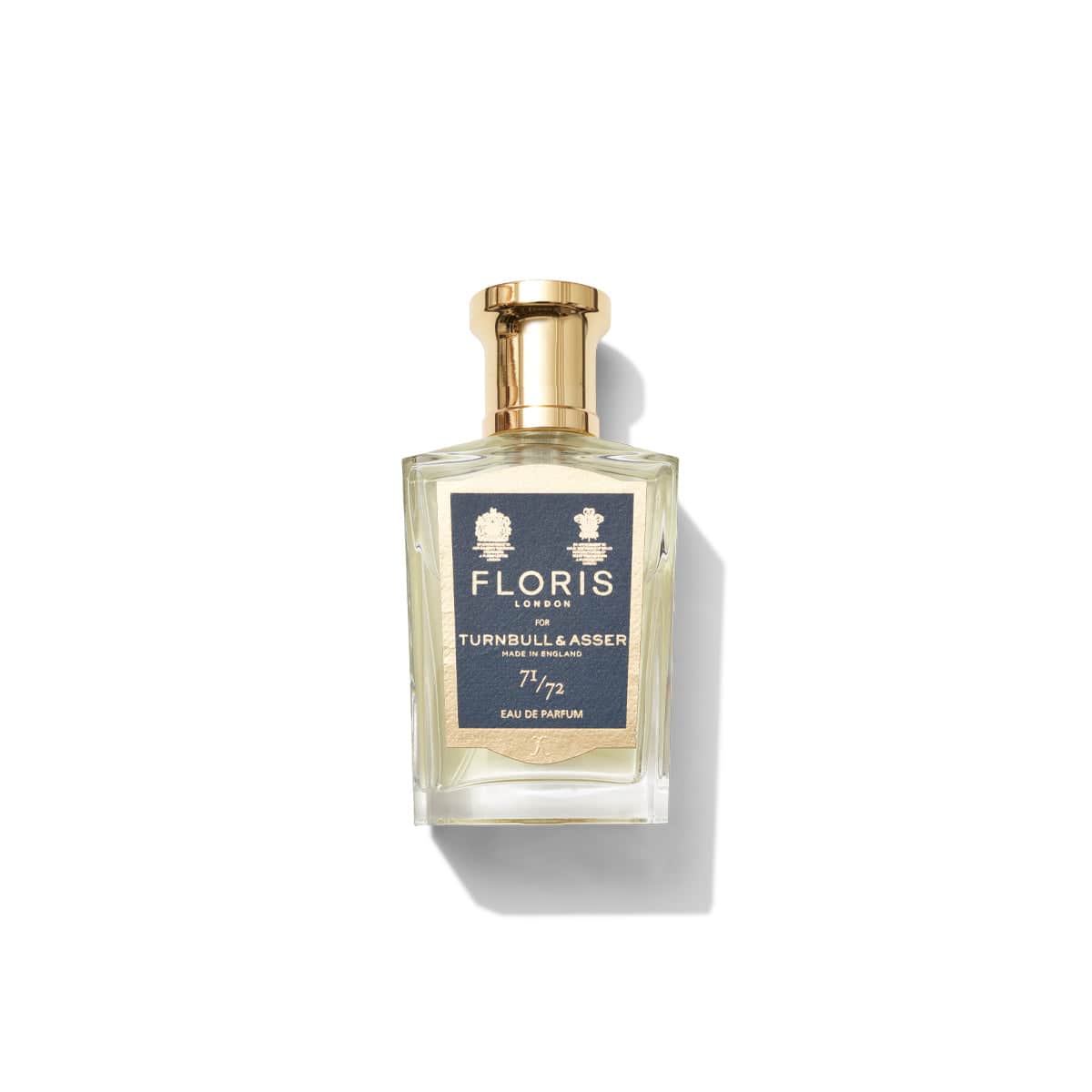 A bottle of Floris London 71/72 Eau de Parfum, a distinguished fragrance for men, with a gold cap on a white background. Perfectly capturing the essence of Jermyn Street bespoke fashion.