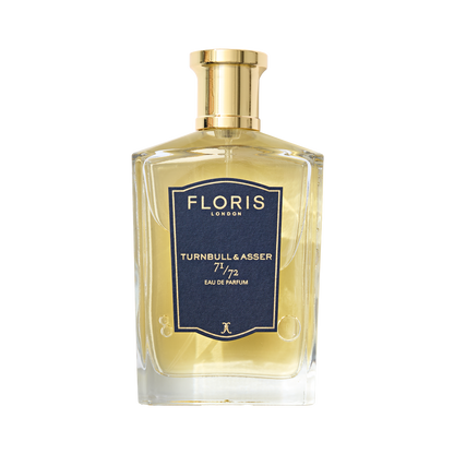 A bottle of Floris London 71/72 - Eau de Parfum, a vegan woody scent, with a gold cap and navy blue label.