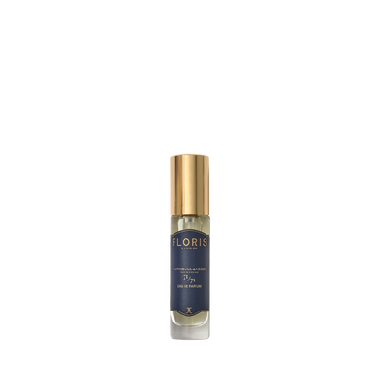 A small Floris London 71/72 Eau de Parfum bottle with a gold cap and dark blue label, featuring a woody scent, on a plain white background.