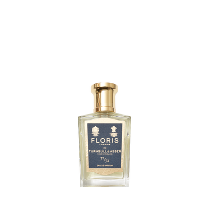 A clear Eau de Parfum bottle with a gold cap and blue label inscribed "Floris London 71/72"—a refined woody scent by Floris London.
