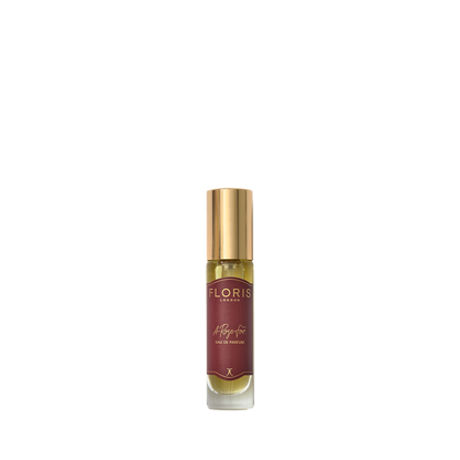 A small glass perfume bottle with a gold cap and "Floris London" red label, A Rose For... Eau de Parfum—ideal for rose or amber fragrance lovers.