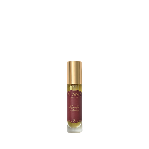 A small glass perfume bottle with a gold cap and "Floris London" red label, A Rose For... Eau de Parfum—ideal for rose or amber fragrance lovers.