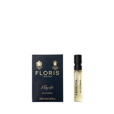 A sample vial of Floris London A Rose For... Eau de Parfum beside its dark blue and gold box—a sophisticated floral and woody scent.