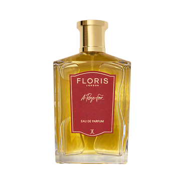 A gold Floris London A Rose For... Eau de Parfum bottle with a red and gold cap is displayed on a white background.