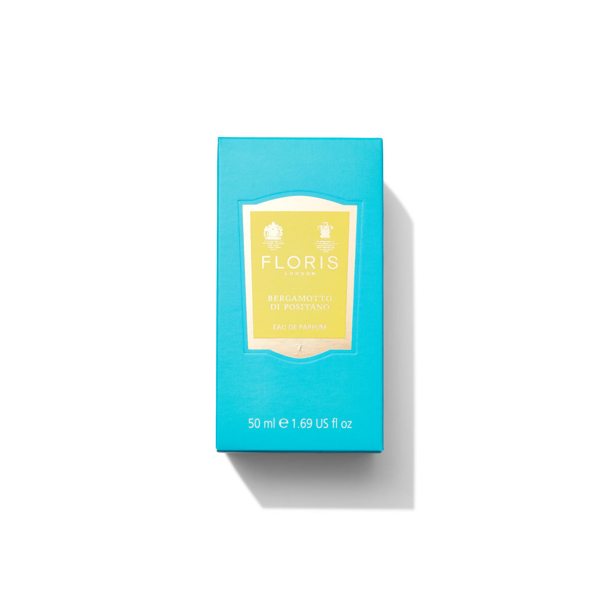 A turquoise box of Bergamotto di Positano Eau de Parfum, 50 ml, by Floris London, with a yellow label in the center, evokes the essence of a Mediterranean sea breeze with its fresh bergamot and warm marine notes.