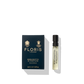 A small vial of Floris London's Bergamotto di Positano Eau de Parfum, featuring fresh bergamot and warm marine notes, comes in its distinctive dark blue box packaging.