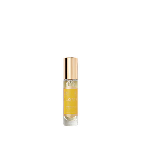 The Floris London Bergamotto di Positano Eau de Parfum, in a small glass bottle with gold cap and yellow label, evokes bergamot and orange blossom.