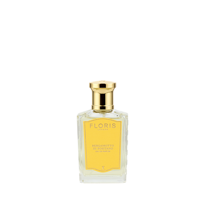 A bottle of Floris London Bergamotto di Positano Eau de Parfum, with bergamot and marine notes, gold cap, and yellow label on a white background.