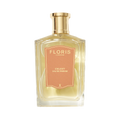 A clear glass bottle of Floris London UK Celest - Eau de Parfum with a gold cap and peach label, filled with light yellow perfume, on a white background.