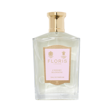 A clear glass bottle of Floris London Cherry Blossom - Eau de Parfum with a gold cap and pink label, capturing the cherry blossom fragrance.