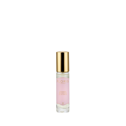 A small glass perfume bottle with a gold cap, labeled "Floris London Cherry Blossom - Eau de Parfum," featuring a floral-fruity Hanami-inspired scent.