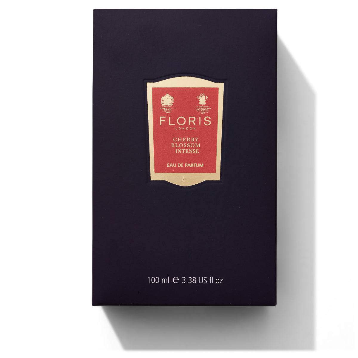 Floris London Cherry Blossom Intense Eau de Parfum in a 100 ml bottle, enclosed in a dark box with a red and gold label, offers a luxurious self-care experience.