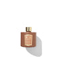 A Floris London Cinnamon & Tangerine Reed Diffuser, with its golden cap, sits on the white background casting a shadow that evokes an intriguing fragrance reminiscent of a rich spice blend.