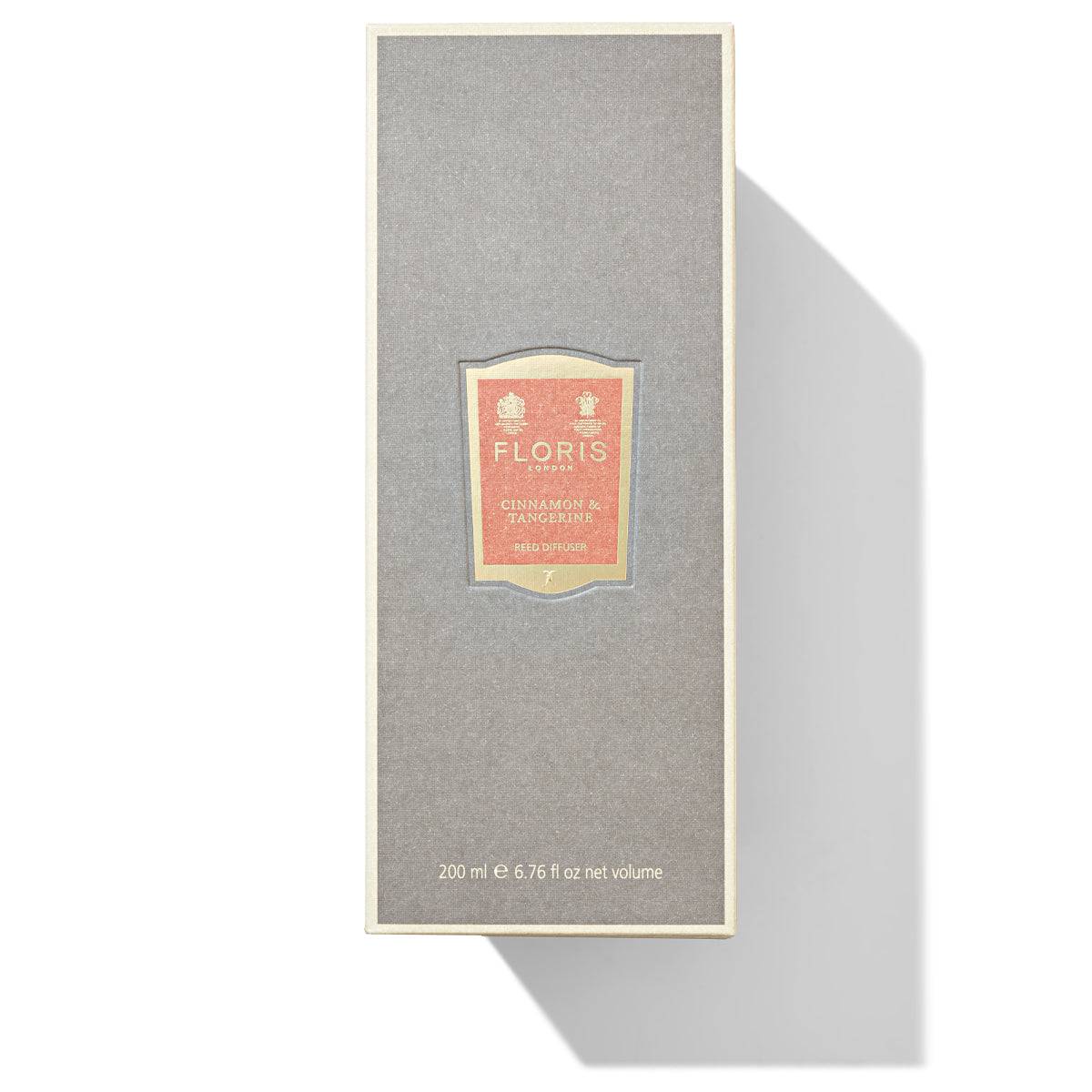 Gray rectangular box featuring the "Floris London" logo and "Cinnamon & Tangerine - Reed Diffuser" text in the center, evoking a rich spice blend of orange and tangerine. Shadow to the right.