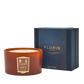 The Floris London Cinnamon & Tangerine Deluxe Three Wick Candle sits beside a navy blue box labeled "Cinnamon & Tangerine.