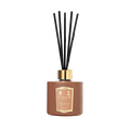 Floris London Cinnamon & Tangerine Reed Diffuser features a brown bottle with black reeds and gold label, offering a rich, room-filling fragrance.