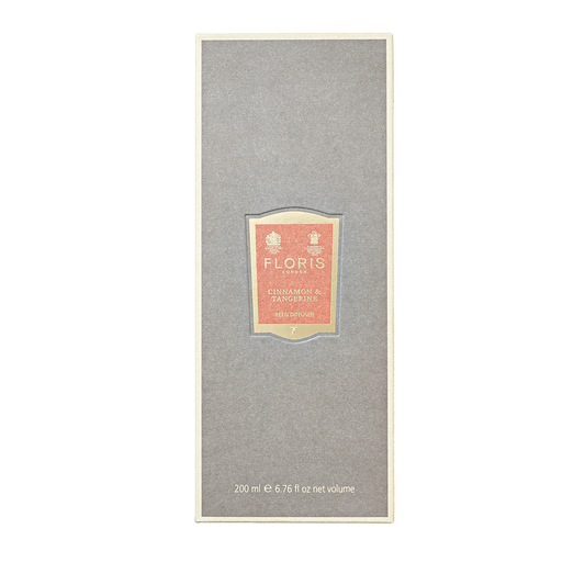 A gray rectangular Floris London box labeled "Cinnamon & Tangerine - Reed Diffuser 200ml," with gold and orange accents—ideal for gifting.