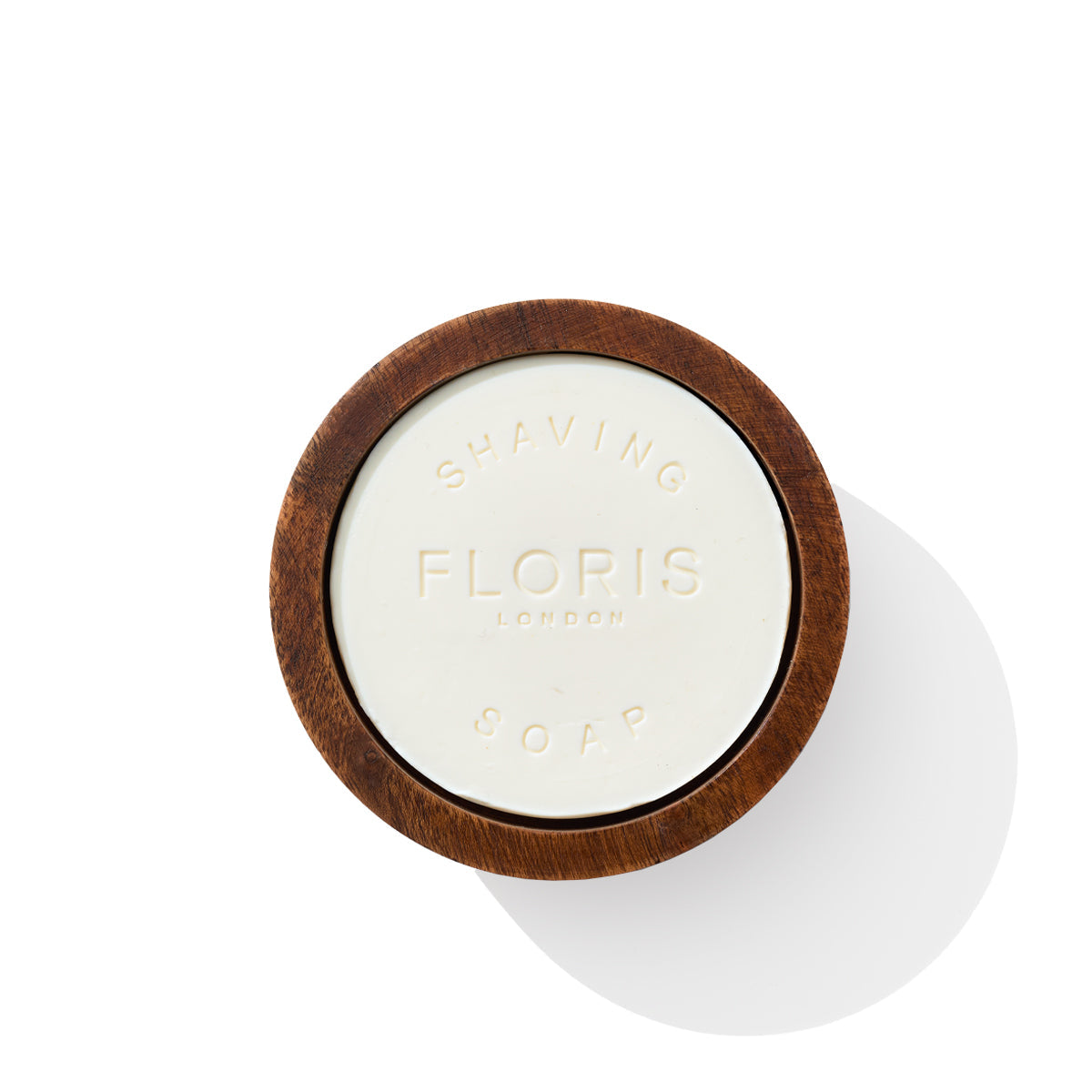 A round shaving soap in a wooden bowl with "Floris London" embossed on it, enriched with shea butter, viewed from above. The product is named Elite - Shaving Soap & Bowl.