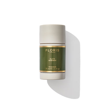 A 75 ml stick of Floris London's Elite Deodorant Stick, featuring a green and gold label and enriched with vitamin E, casting a shadow on a white background.