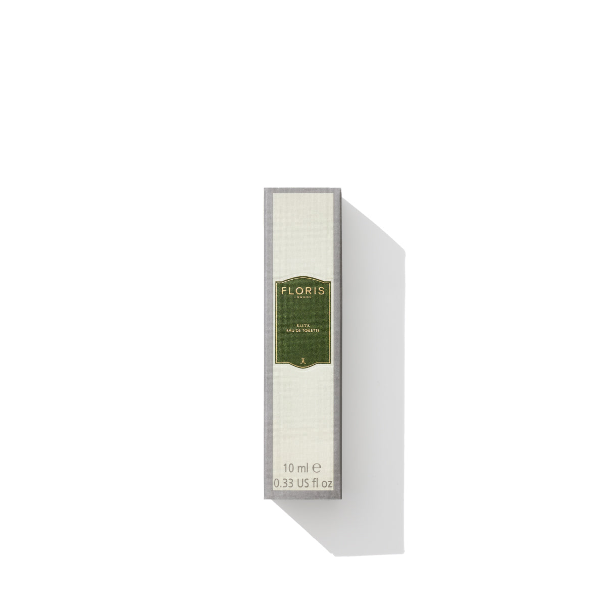 A box of Floris London Elite Eau de Toilette, 10 ml, with a green and gold label in minimalist packaging against a white background exudes a timeless scent. The woody fragrance captures a distinct British character that is both elegant and refined.