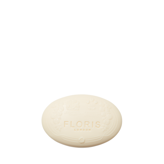 Oval-shaped white Elite - Luxury Soap by Floris London with embossed floral design, displayed on a plain white background.