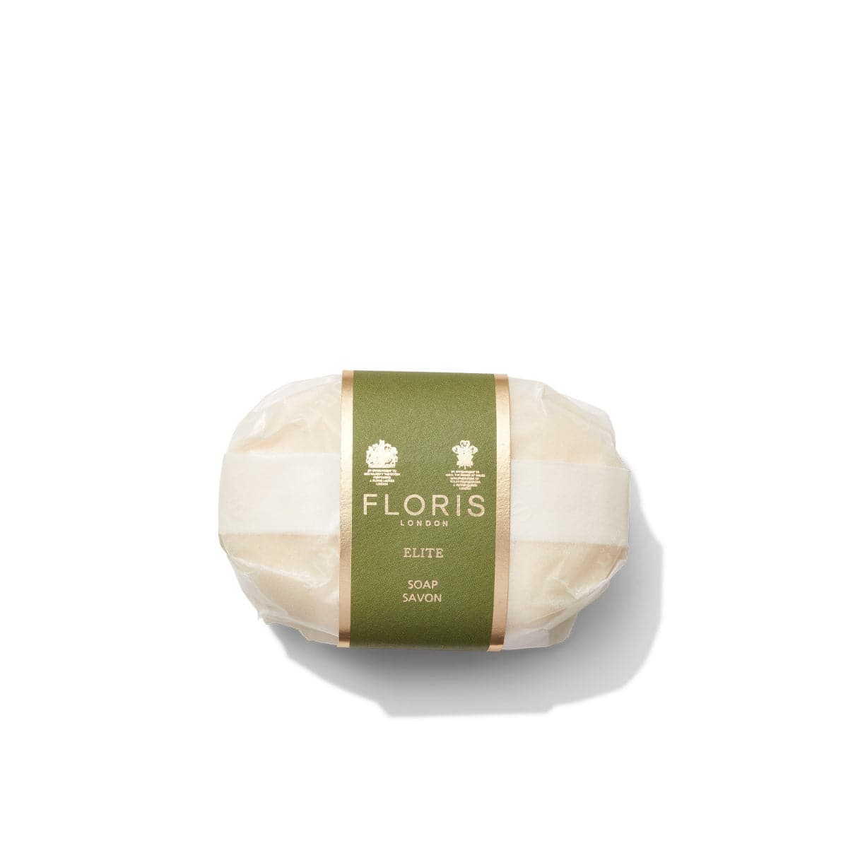 An oval Elite - Luxury Soap bar from Floris London, wrapped in clear packaging with a green and gold label, featuring the luxurious addition of shea butter, shown against a white background.