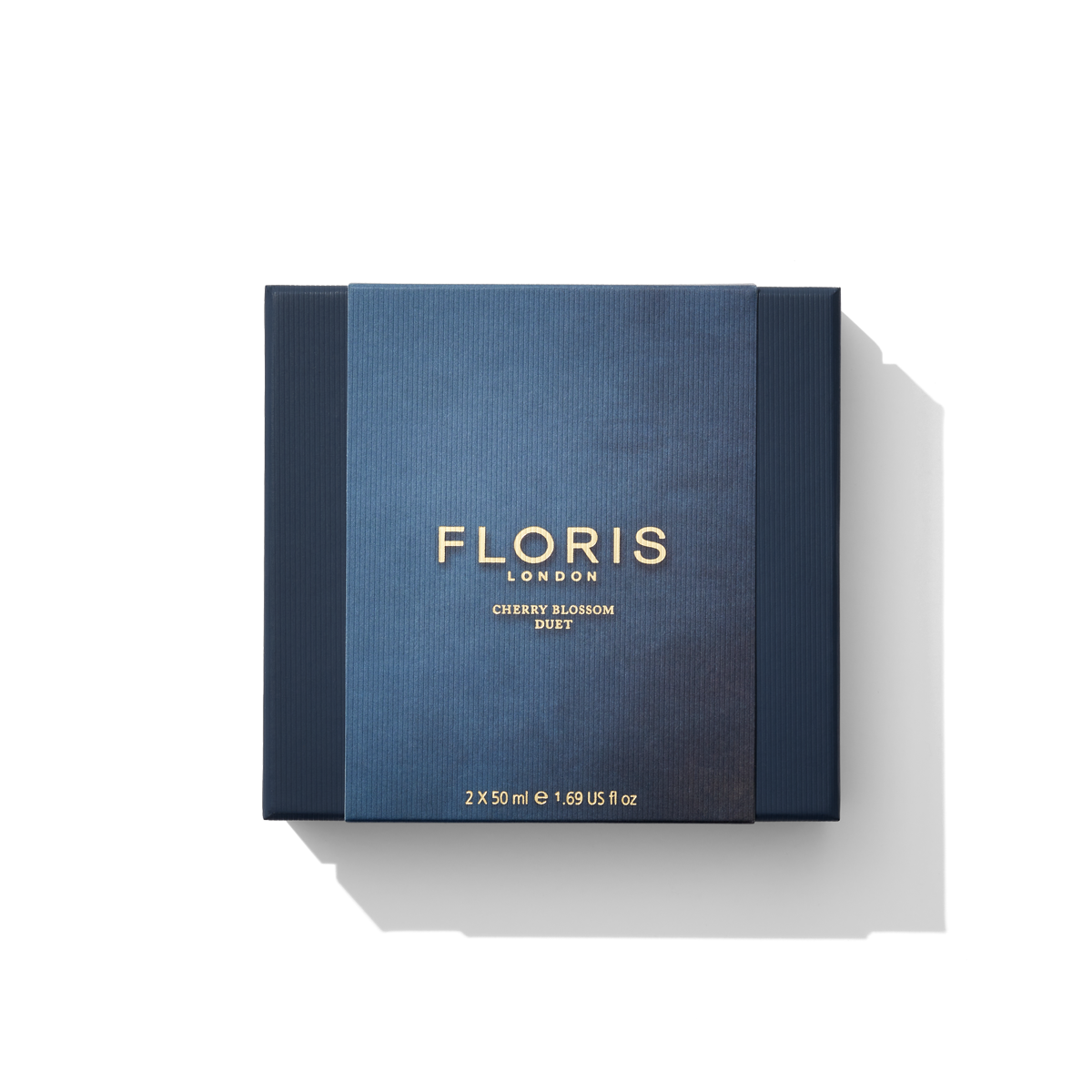 The Floris London Cherry Blossom Duo gift set showcases a packaging with an intense dark blue and gold design.