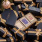 A boxed Soap Collection For Her from Floris London, featuring three exquisite soap products, nestled in-between beautifully gift wrapped presents. This luxurious gift set is perfect for the holiday season.