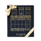 Floris London US "The Icon | No. 89 Duo" gift box in navy with gold building illustration, logo, and finished with a gold ribbon bow.