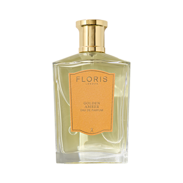 A vegan perfume in a glass bottle with a gold cap and amber label: Floris London Golden Amber - Eau de Parfum.