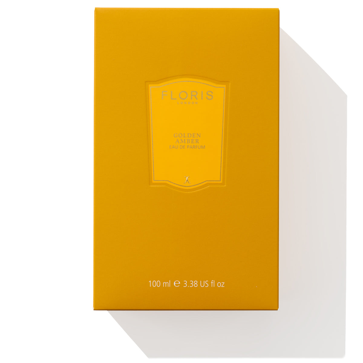 A yellow rectangular perfume box labeled "Golden Amber - Eau de Parfum, 100 ml (3.38 US fl oz)" by Floris London features a luxurious blend with a floral heart and subtle aquatic notes.