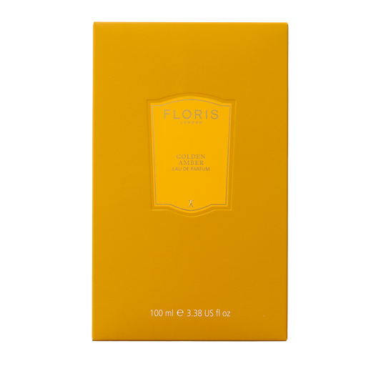 Floris London Golden Amber - Eau de Parfum, 100 ml: a luxurious vegan scent in an elegant yellow box with embossed label and text.