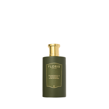 A green Floris London Grapefruit & Rosemary Room Fragrance with a gold label and pump, featuring a fresh, zesty grapefruit scent.