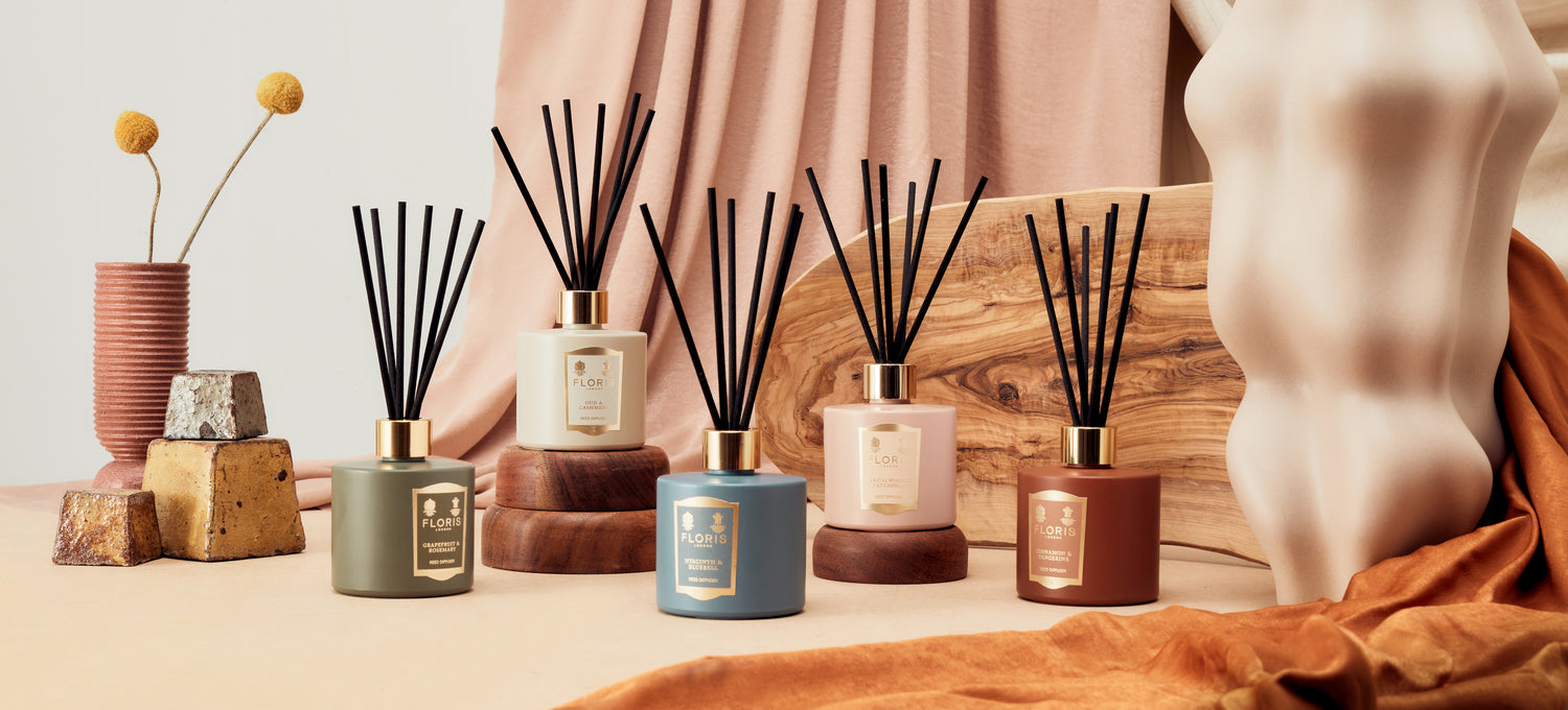 Display for Floris London US's home diffuser collection, highlighting a stylish diffuser bottle in a cozy home setting.