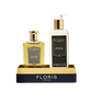 Floris London US Sweet Lux | Honey Oud Duo set with Eau de Parfum and moisturizer in a black and gold box.