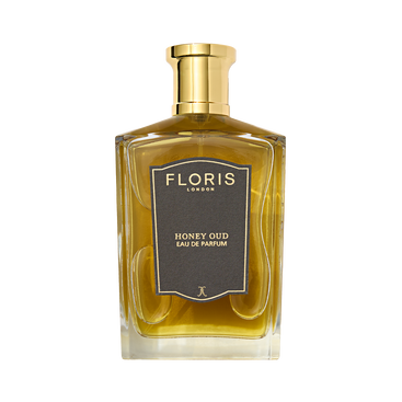 A bottle of Floris London Honey Oud Eau de Parfum, blending English honey and oud, with a gold cap and dark front label.