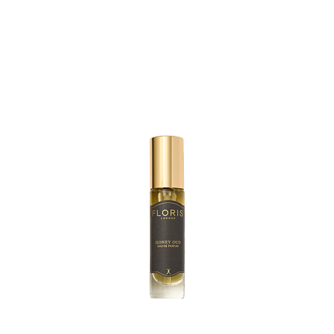 A small bottle of Floris London Honey Oud - Eau de Parfum, featuring rich oud oil and English honey, with a gold cap and dark label.