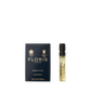 A Floris London Honey Oud - Eau de Parfum sample vial stands beside its navy blue and gold box, evoking the warmth of English honey and oud.