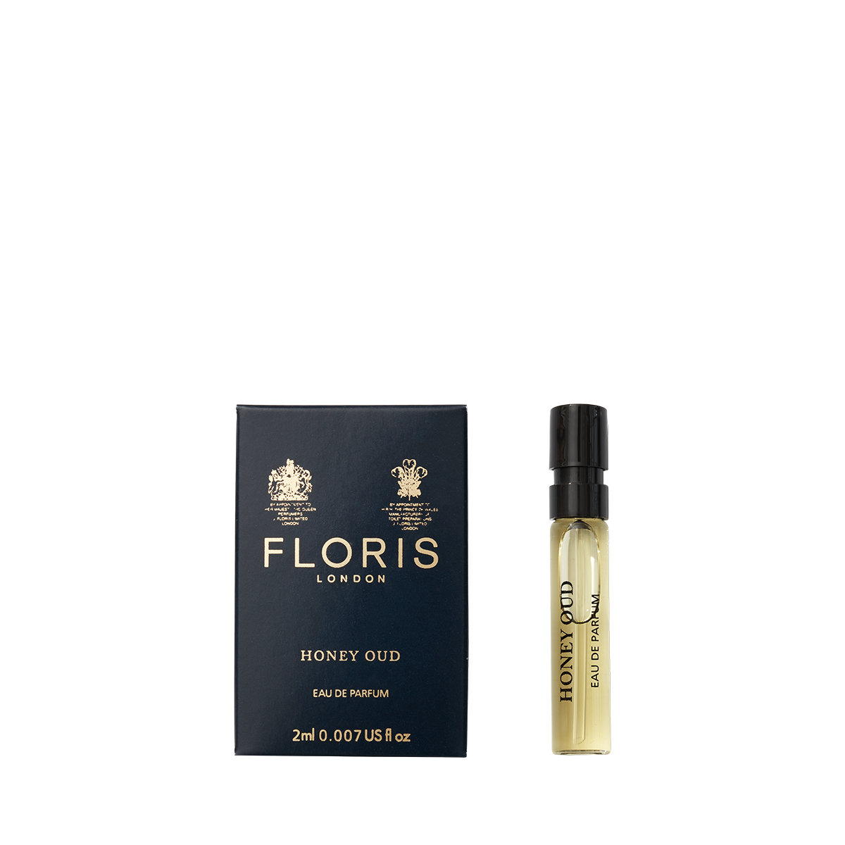 A Floris London Honey Oud - Eau de Parfum sample vial stands beside its navy blue and gold box, evoking the warmth of English honey and oud.