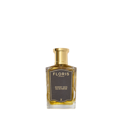 A bottle of Floris London Honey Oud - Eau de Parfum, featuring a gold cap and dark label, is pictured on a white background.
