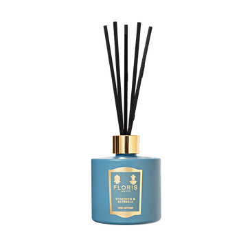 The Floris London Hyacinth & Bluebell Reed Diffuser features black reeds, a gold label, and a fresh spring floral scent.
